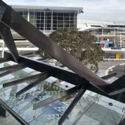 Novotel Auckland Airport by Gorge Grant Engineering. architecture, building, condominium, daylighting, reflection, roof, sky, structure, water, black, gray, white