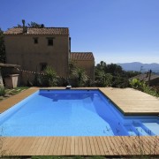 Outdoor living products made of radiata pine from estate, home, house, leisure, property, real estate, resort, sky, swimming pool, villa, teal