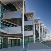 View of the Viaduct Events Center in Auckland's architecture, building, commercial building, condominium, corporate headquarters, daytime, facade, headquarters, metropolitan area, mixed use, sky, structure, teal