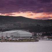 View of Forsyth Bar Stadium in Dunedin. By city, cloud, dawn, dusk, evening, horizon, loch, morning, sea, sky, structure, sunset, water, black, gray