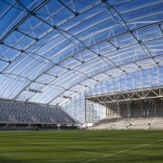 Anderson Lloyd provided the legal support necessary for architecture, arena, atmosphere, atmosphere of earth, corporate headquarters, daylighting, daytime, grass, sky, soccer specific stadium, sport venue, stadium, structure, teal