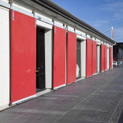 External view of a building in Wynyard Quater architecture, building, door, facade, house, infrastructure, line, metropolitan area, red, sky, structure, window, gray