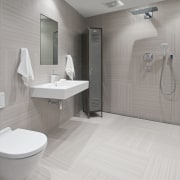 This bathroom was the winner of the small bathroom, floor, interior design, plumbing fixture, product design, room, tile, toilet, toilet seat, gray