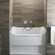 This bathroom fitting was designed by the Kohler angle, bathroom, bathtub, floor, flooring, plumbing fixture, product, product design, tile, gray