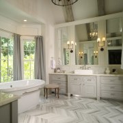 This master suite's architects were James Hess and bathroom, bathroom accessory, bathroom cabinet, cabinetry, countertop, estate, floor, flooring, home, interior design, room, tile, window, gray