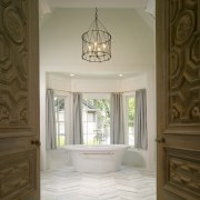 This master suite's architects were James Hess and architecture, ceiling, column, daylighting, estate, floor, flooring, hardwood, home, interior design, molding, property, real estate, room, wall, window, wood, wood flooring, gray, brown