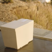 This bathroom fitting was designed by the Kohler box, furniture, product design, table, orange, brown