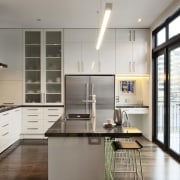 This house was designed by Gina Jones of cabinetry, countertop, cuisine classique, home appliance, interior design, kitchen, gray