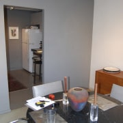 This home was remodeled by Forma Inc. A apartment, furniture, home, house, interior design, living room, room, table, gray