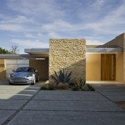 This house was remodeled by Robert Swatt of architecture, elevation, estate, facade, family car, home, house, luxury vehicle, property, real estate, residential area, teal