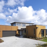 This Upper Hutt Show home was designed and architecture, elevation, facade, home, house, property, real estate, shed, sky, white