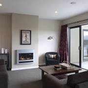 This Upper Hutt Show home was designed and ceiling, floor, flooring, hearth, home, interior design, living room, property, real estate, room, suite, window, gray, white, black