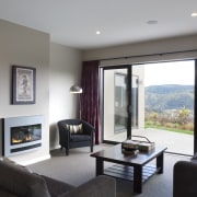 This Upper Hutt Show home was designed and interior design, living room, property, real estate, room, window, gray