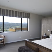 This Upper Hutt Show home was designed and architecture, bedroom, daylighting, house, interior design, real estate, room, window, gray