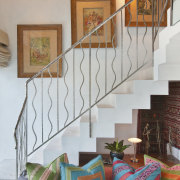 This homes' kitchen was designed by Mick De handrail, home, interior design, living room, real estate, stairs, wall, gray