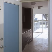 This homes' kitchen was designed by Mick De door, floor, home, house, property, real estate, room, window, gray