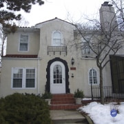 This house was remodeled by Tom Ellison of building, estate, facade, historic house, home, house, mansion, neighbourhood, property, real estate, residential area, roof, snow, tree, window, winter, gray, black