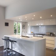 View fo kitchen. Wood floors and white cabinatry. architecture, cabinetry, ceiling, countertop, cuisine classique, daylighting, floor, flooring, hardwood, house, interior design, kitchen, laminate flooring, real estate, room, wood flooring, gray