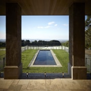 View of outdoor area and lap pool. Stonehaven architecture, cloud, daylighting, estate, grass, home, house, real estate, reflection, sky, structure, water, window, wood, brown, black