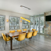 The interior of this home was designed by architecture, ceiling, dining room, house, interior design, real estate, table, gray