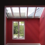 The home was renovated by Maddalena Vienna of architecture, ceiling, daylighting, house, window, red, black