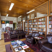 This home in Queenstown was renovated by architect antiquarian, bookcase, bookselling, institution, interior design, library, library science, living room, public library, real estate, brown