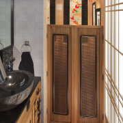 Swing doors provided a traditional feel and helped cabinetry, door, floor, flooring, hardwood, wood, brown