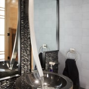 Silver-coloured wallpaper adds to the exotic feel of bathroom, countertop, floor, flooring, interior design, plumbing fixture, room, sink, tap, tile, black, gray