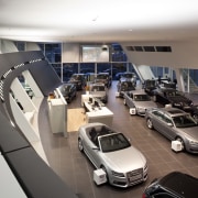 Here is a view of the new Giltrap auto show, automotive design, bmw, car, car dealership, executive car, luxury vehicle, motor vehicle, vehicle, white, gray