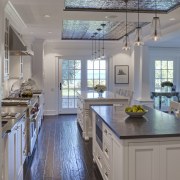 View of kitchen in 1950's remodelled lakefront home cabinetry, ceiling, countertop, cuisine classique, daylighting, floor, flooring, home, interior design, kitchen, real estate, room, window, wood flooring, gray