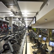 Here is a view of the Les Mills gym, room, sport venue, structure, gray, black