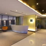 Here is the Maybank Tower in Singapore which ceiling, interior design, lighting, lobby, real estate, gray, orange, brown