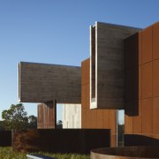 Here is an exterior view of the University architecture, building, corporate headquarters, elevation, facade, home, house, real estate, residential area, sky, teal