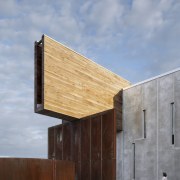 Here is an exterior view of the University architecture, building, daylighting, facade, house, sky, wood, gray