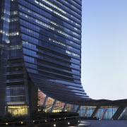 Here is a view of the ICC (International architecture, building, commercial building, condominium, corporate headquarters, daytime, headquarters, landmark, metropolis, metropolitan area, mixed use, reflection, sky, skyscraper, tower, tower block, blue