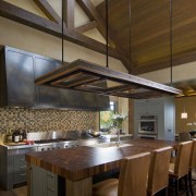 View of kitchen, great room and wine cellar. beam, cabinetry, ceiling, countertop, cuisine classique, daylighting, interior design, kitchen, table, wood, brown