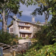 Exterio view of multi story home with trees building, cottage, estate, facade, home, house, leaf, mansion, plant, property, real estate, sky, tree, villa, brown