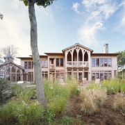 View of gothic colonial house with landscaping in cottage, estate, facade, farmhouse, home, house, land lot, mansion, plantation, property, real estate, villa, white