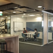 Here is a view of the new Telecom ceiling, glass, interior design, office, black, gray, brown