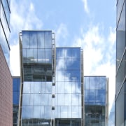 Here is a view of the new Telecom architecture, building, city, commercial building, condominium, corporate headquarters, daytime, facade, headquarters, metropolis, metropolitan area, mixed use, sky, skyscraper, tower block, teal