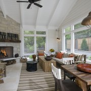 View of open plan dining and lounge area hearth, interior design, living room, outdoor structure, patio, porch, real estate, gray