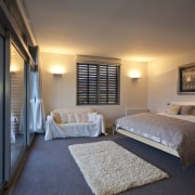 This home was designed by architect Nick Karlovsky. architecture, bedroom, ceiling, estate, hotel, interior design, real estate, room, suite, gray