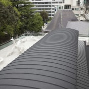 Auckland Waterproofing ensured that this, the Auckland Art architecture, building, daylighting, daytime, metropolitan area, outdoor structure, residential area, roof, urban area, walkway, gray