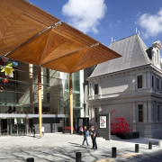 Here is a view of the Auckland Art building, facade, mixed use, town, white