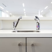 Seen here is a drinking-water system designed by bathroom, lighting, plumbing fixture, product design, sink, tap, white, gray