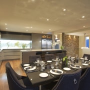 This home was designed by Jason Saunders of ceiling, countertop, dining room, interior design, kitchen, real estate, room, brown, black