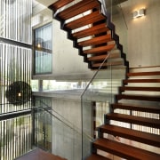 This home was designed with environmental principals in architecture, baluster, daylighting, estate, handrail, interior design, lobby, real estate, stairs