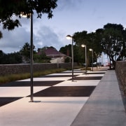 Here is a view of LED, energy-efficient street architecture, asphalt, cloud, infrastructure, line, plant, public space, residential area, road, road surface, sky, street light, tree, walkway, black