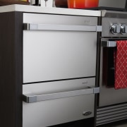 Here is a view of Fisher &amp; Paykel's chest of drawers, drawer, furniture, gas stove, home appliance, kitchen, kitchen appliance, kitchen stove, major appliance, product, refrigerator, black, gray