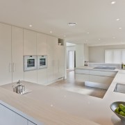 View of light coloured contemporary kitchen with vase countertop, interior design, kitchen, property, real estate, room, gray